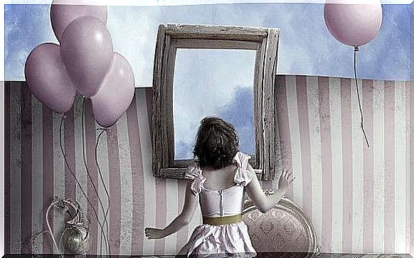 Girl standing in front of window with balloons in hand