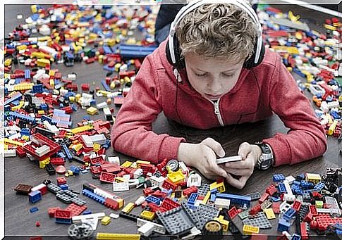 Boy chooses the phone over lego, as parents have chosen to give children a phone