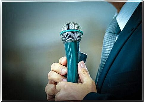 Man with microphone has fear of speaking in public