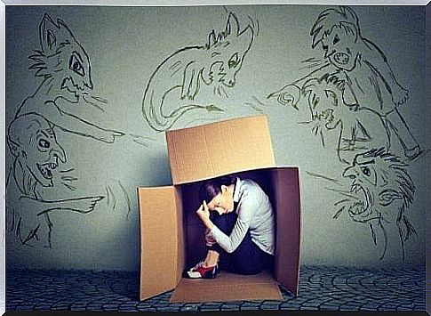 A woman hiding in a cardboard box