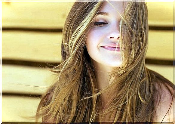 Woman smiles and chooses to think positively