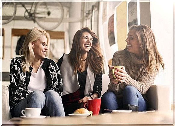 Friends laugh together as they choose to think positively