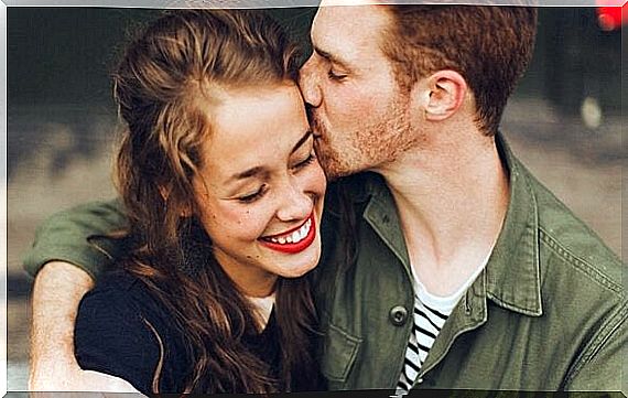 Man kissing woman's cheek