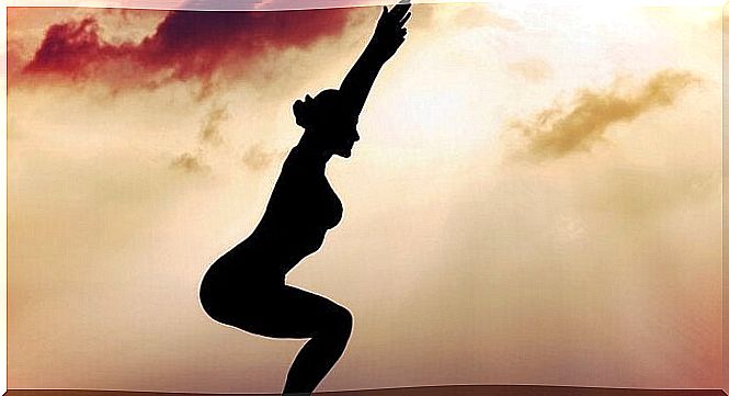 Silhouette of woman practicing tai chi