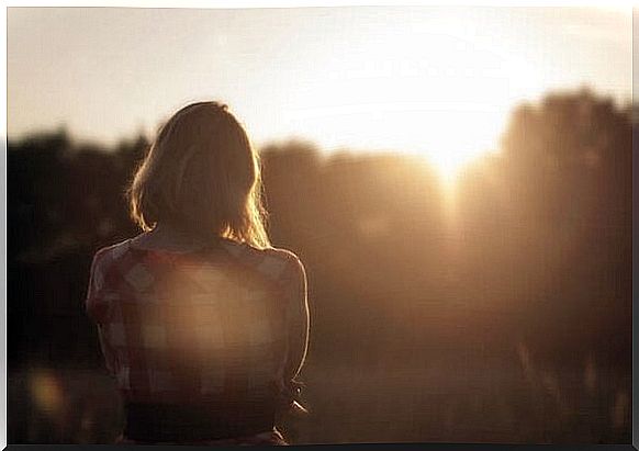 Lonely woman in sunlight