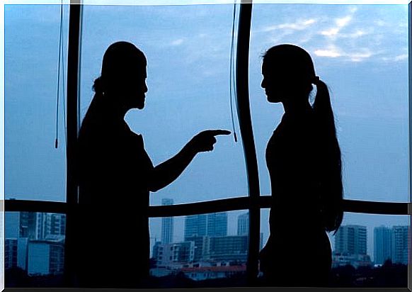 Silhouette of people arguing