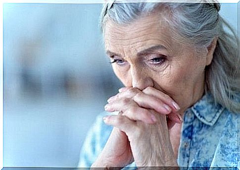 A worried elderly woman