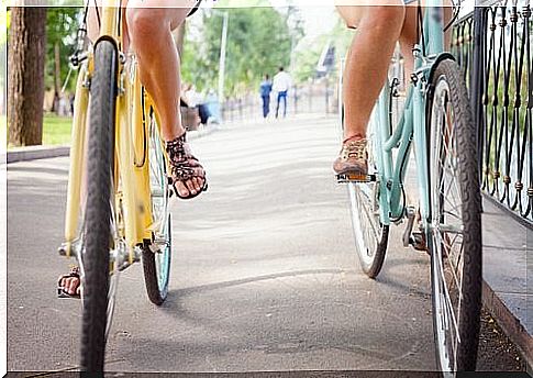 Two friends ride their bikes