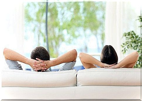 Couple sitting on sofa