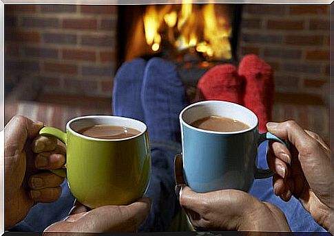 Cozy with coffee in front of the fireplace