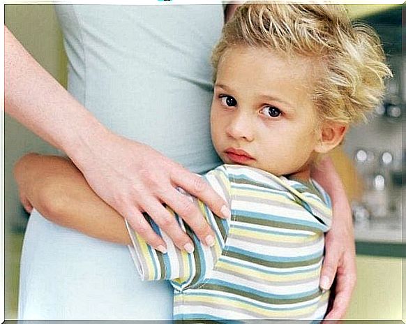 A child hugs his mother, showing addiction