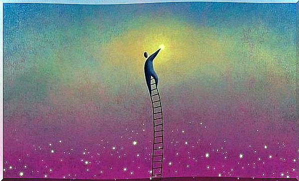 Man stands on ladder to reach star as symbol of dreams