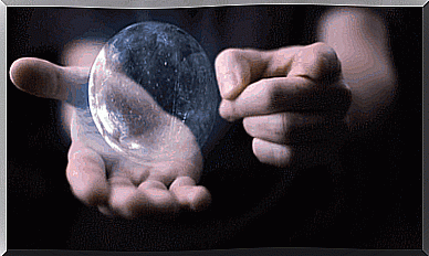 Glass ball of light in hands