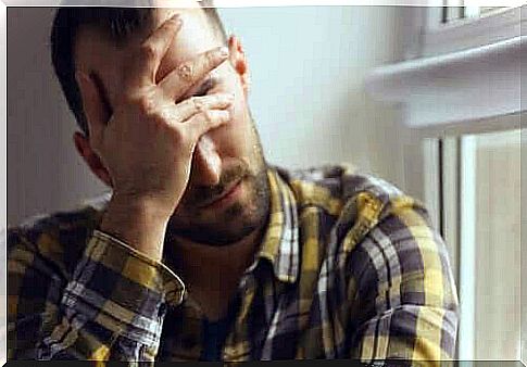 Man with his hand in front of his eyes just wants to live without fear