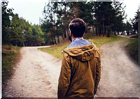 Man stands by the road and has to choose