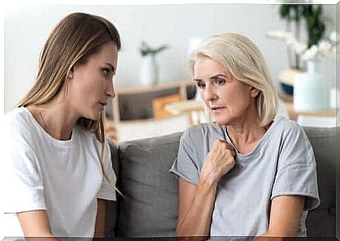 Mother and daughter talk together as a method of conveying how you feel