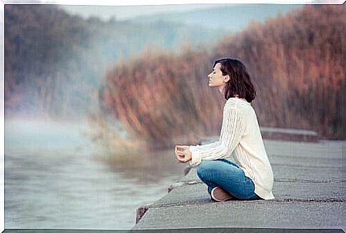 woman meditates in nature