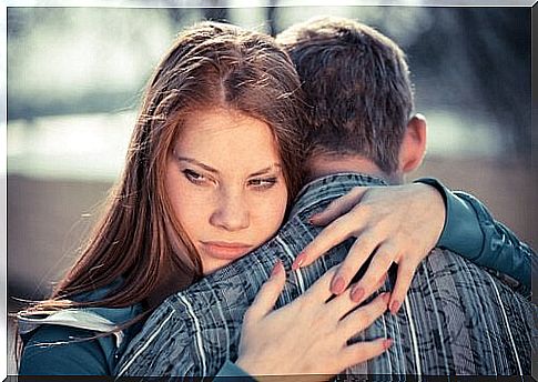 Woman with passive-aggressive personality disorder hugs man