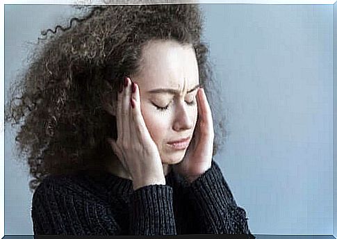 Woman taking care of head needs migraine treatment