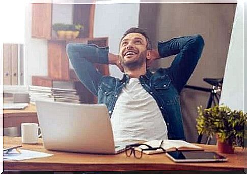 Smiling man at typewriter possesses professional self-awareness