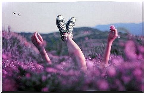 Girl lies in lavender field