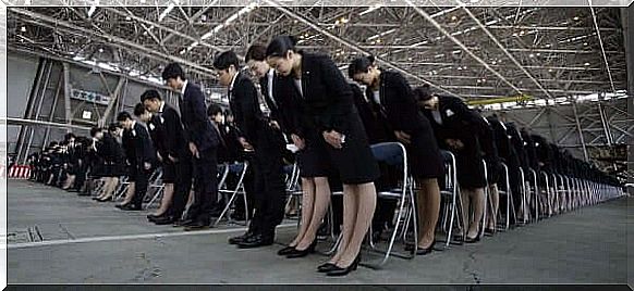 Taijin kyofusho is related to compulsive behavior as seen in this picture of a group of people who are all bent forward