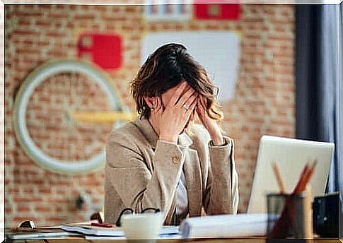 Woman taking care of head illustrates stress in parents