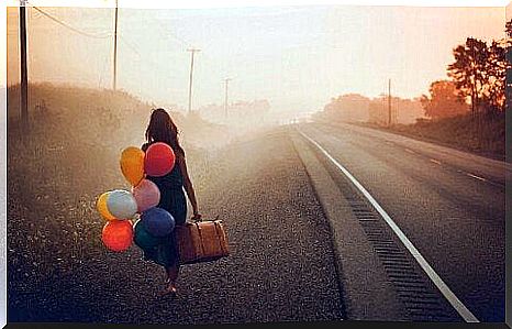 Woman walking with balloons