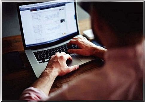 A man typing on computer