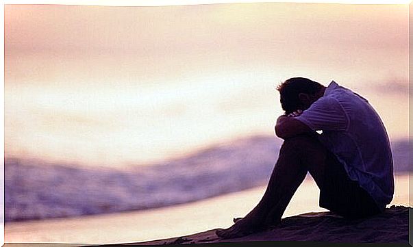 Man without a family sitting alone by the sea