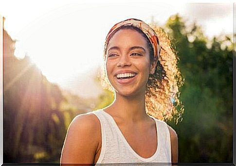 Happy woman smiling outside